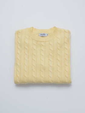 butter yellow cable knit sweater folded