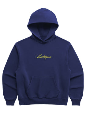 Navy blue hoodie with 'Michigan' in yellow cursive font on the front