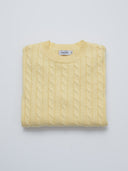 butter yellow cable knit sweater folded