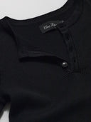 Detail of black ribbed knit henley by One Dna brand