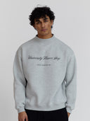 Male model wears University Flower Shop mock neck sweatshirt 