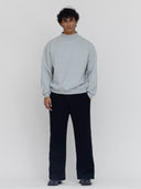 a model wears men's heather gray mock neck sweatshirt by one dna