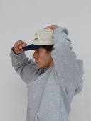 navy and white michigan hat