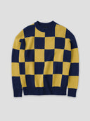 a navy and yellow checkerboard sweater on a flat gray background by one dna brand