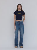 navy baby t with michigan in yellow script font