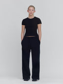 women wearing wide leg sweatpants in black by one dna brand